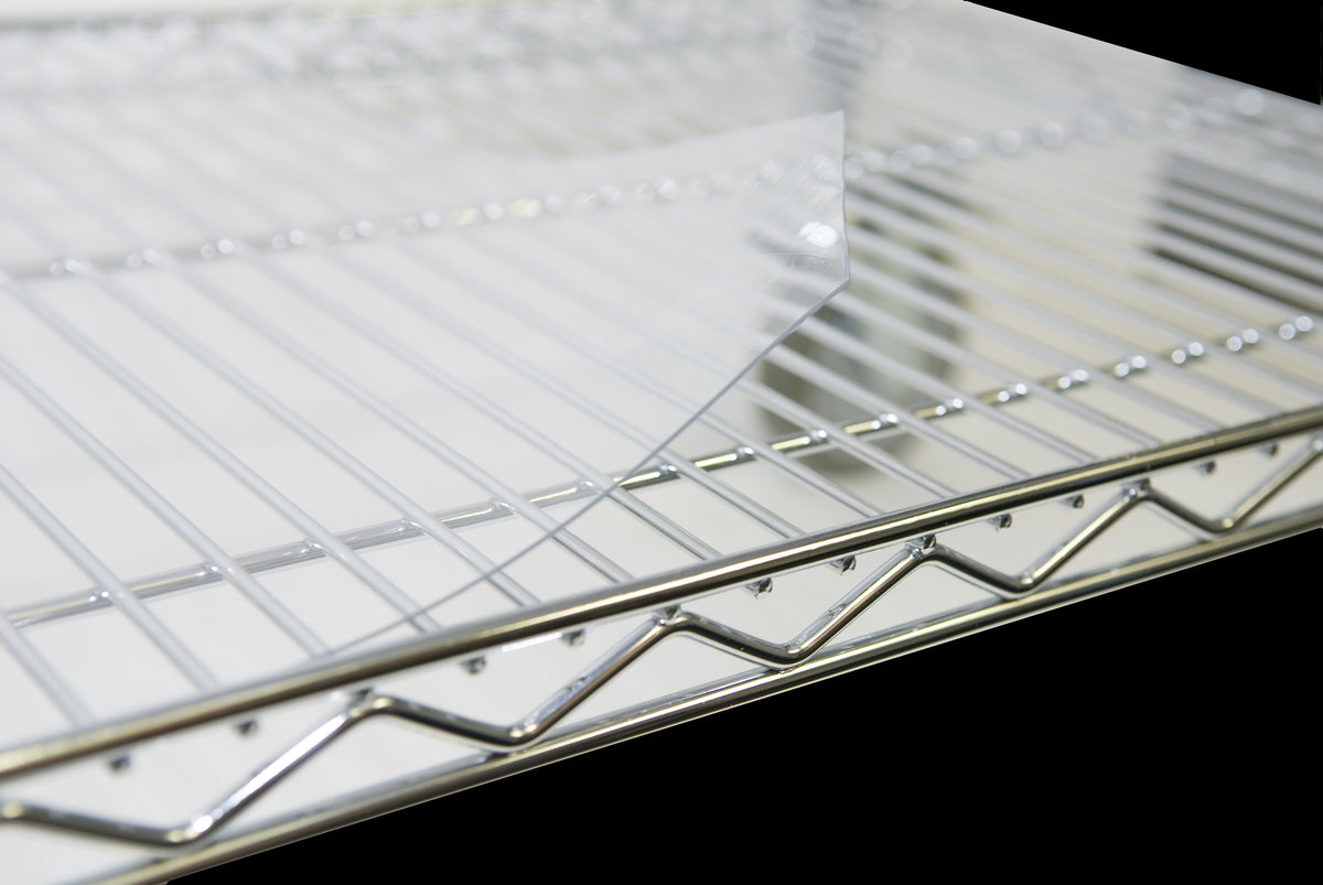 Serv-Ware SMC1836CWP clear PVC shelf mat lying on a wire shelf, close-up