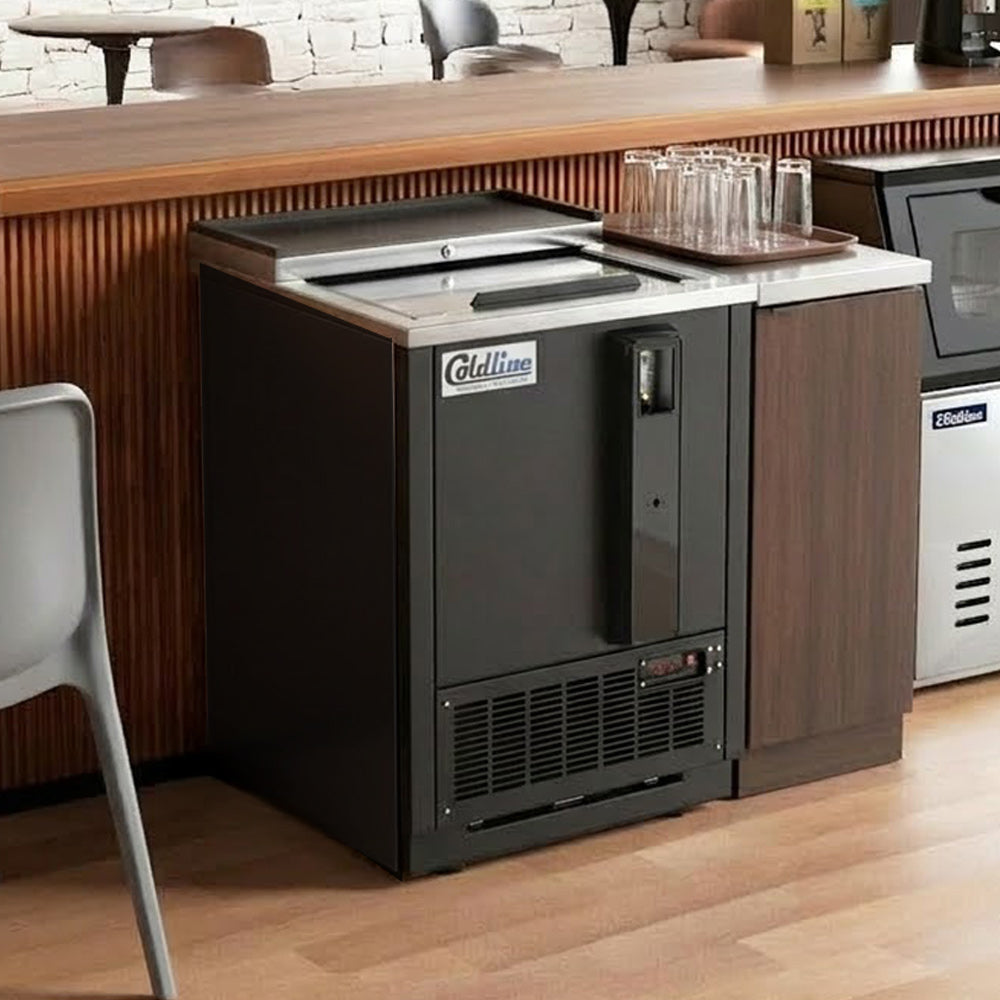 Coldline BBC-25 black horizontal bottle cooler, behind a bar counter (representative image)