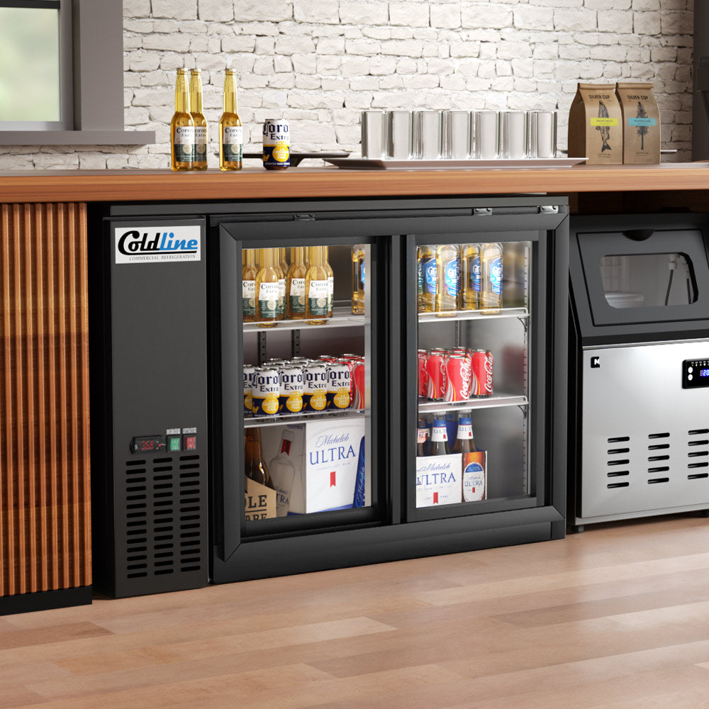Coldline CBB-48G-SL-T black sliding glass door back bar cooler, under a bar counter (representative image)