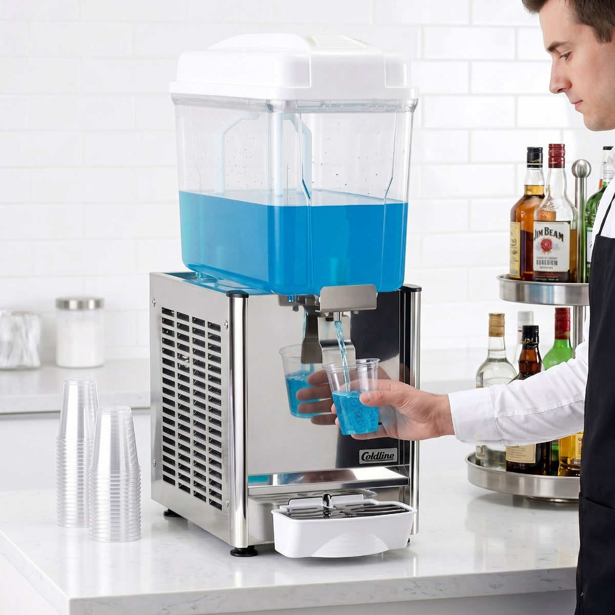 Coldline CBD-1 single bowl refrigerated beverage dispenser, in use, filling a glass at a counter (representative image)