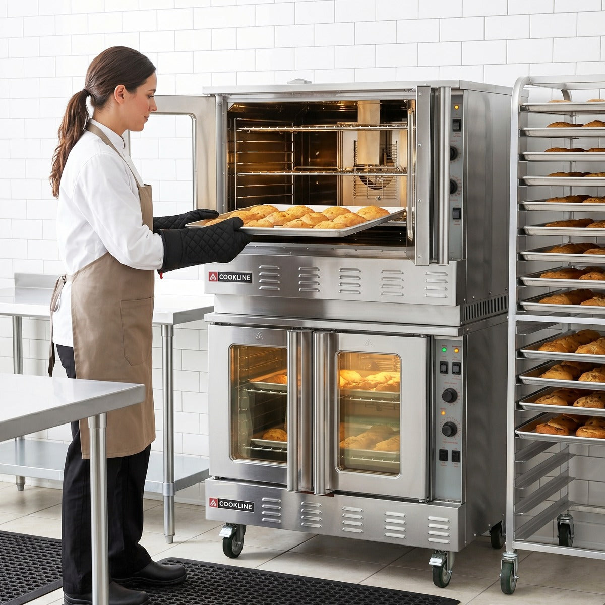 Cookline CC80-LP-DBL deep depth double deck gas convection oven, in use, loading a tray of pastries in a bakery