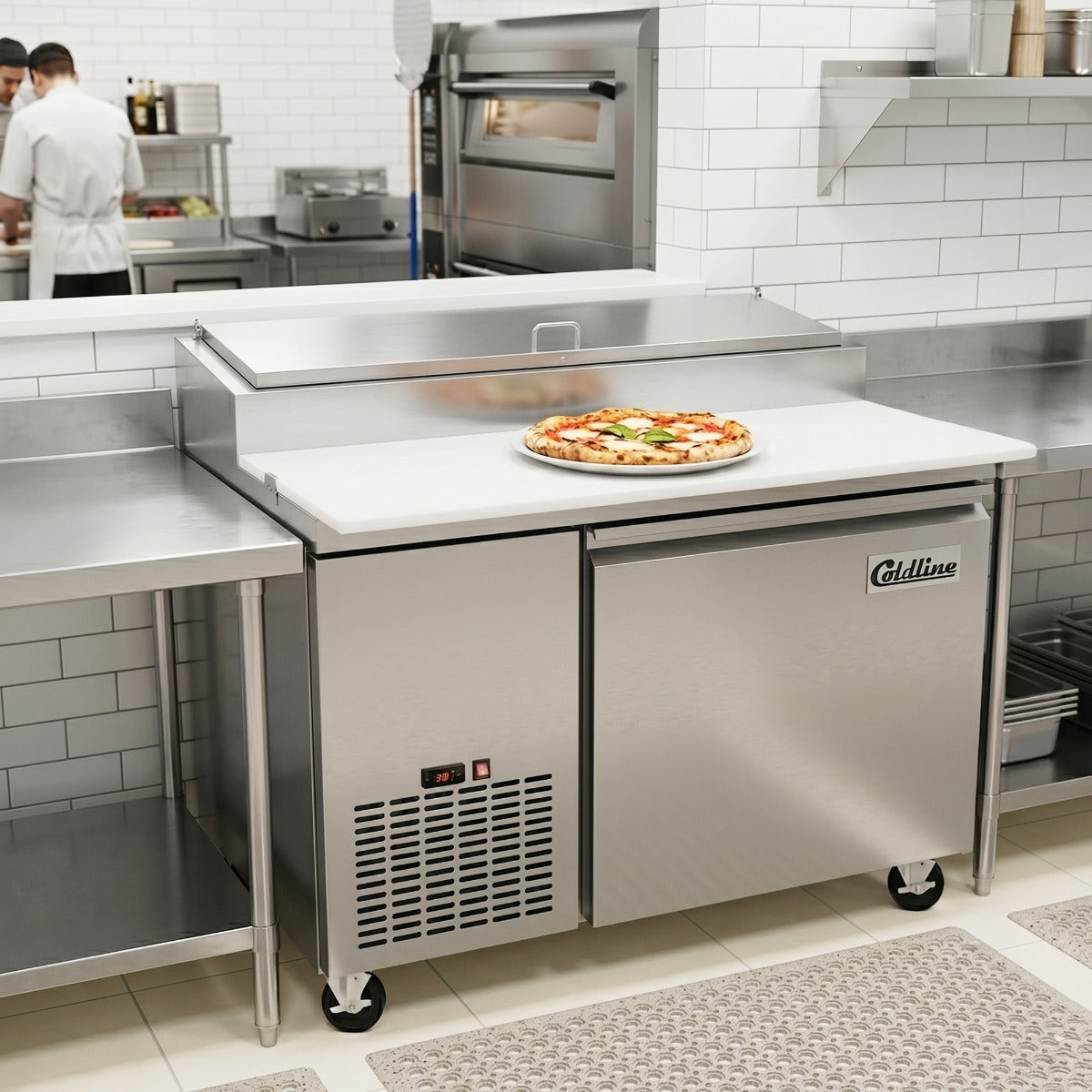 Coldline CPT-44 refrigerated pizza prep table, in use making pizza (representative image)