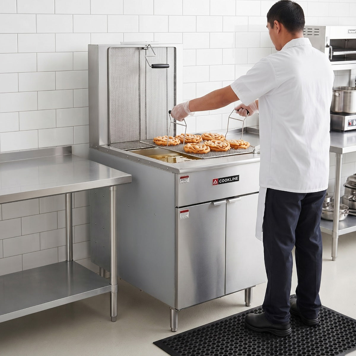 Cookline DOF-170 gas flat bottom donut fryer, in use, donuts on the drip tray