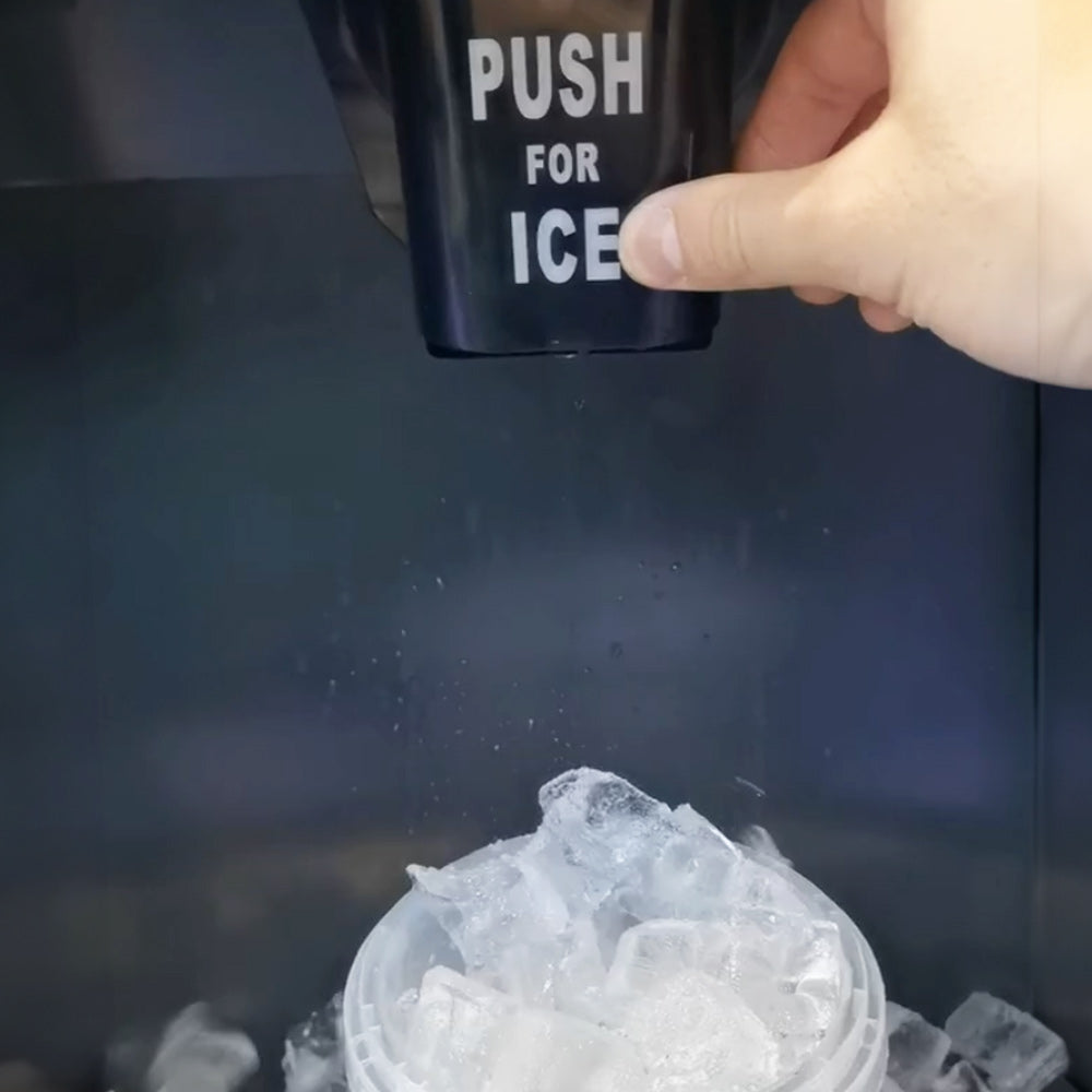 Coldline ICE550-FA-BD250-30 full cube ice machine with dispensing bin, push-for-ice lever dispensing ice into a cup, close-up