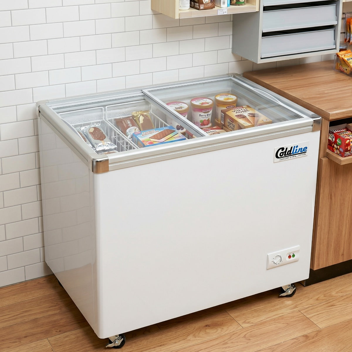 Coldline SD34 flat glass top ice cream display freezer, in a cafe, filled with ice cream