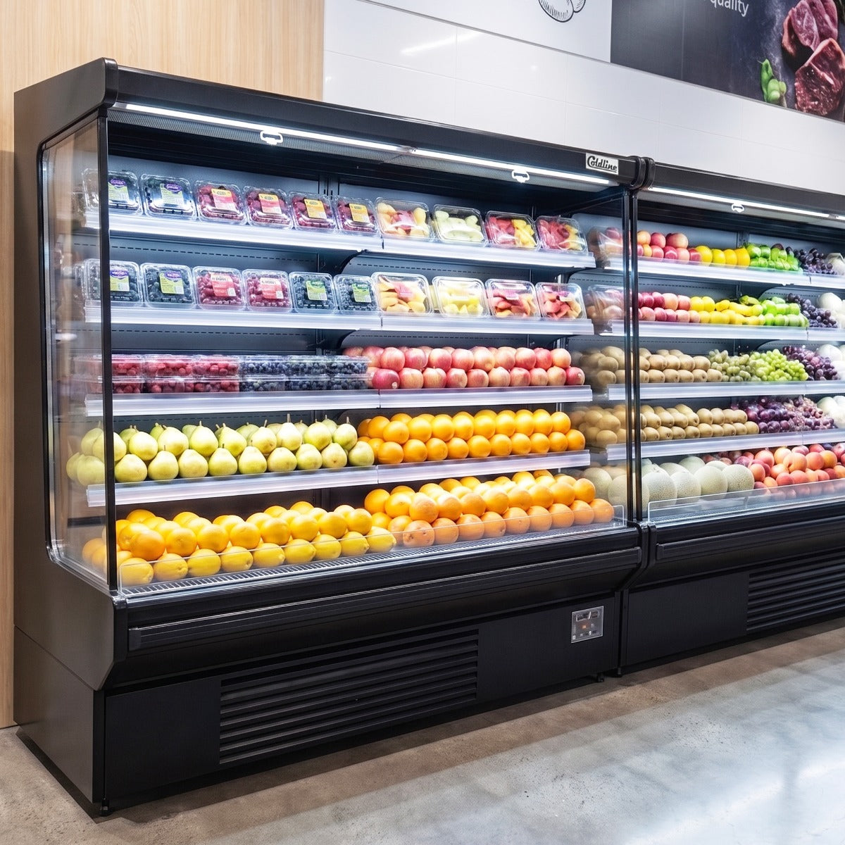 Coldline SOC-76-220-B black open air merchandiser, stocked with produce in a supermarket (representative image)