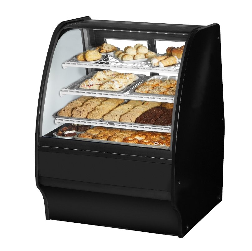 True TGM-DC-36-SC/SC-S-S 36" curved glass dry display case with black exterior, front angle view stocked with baked goods