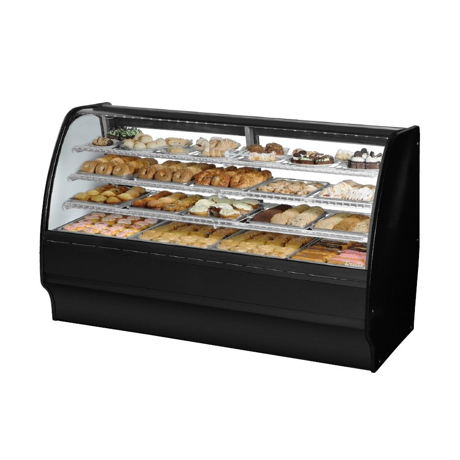 True TGM-DC-77-SC/SC-W-W 77" curved glass dry display case with black exterior, front angle view stocked with baked goods