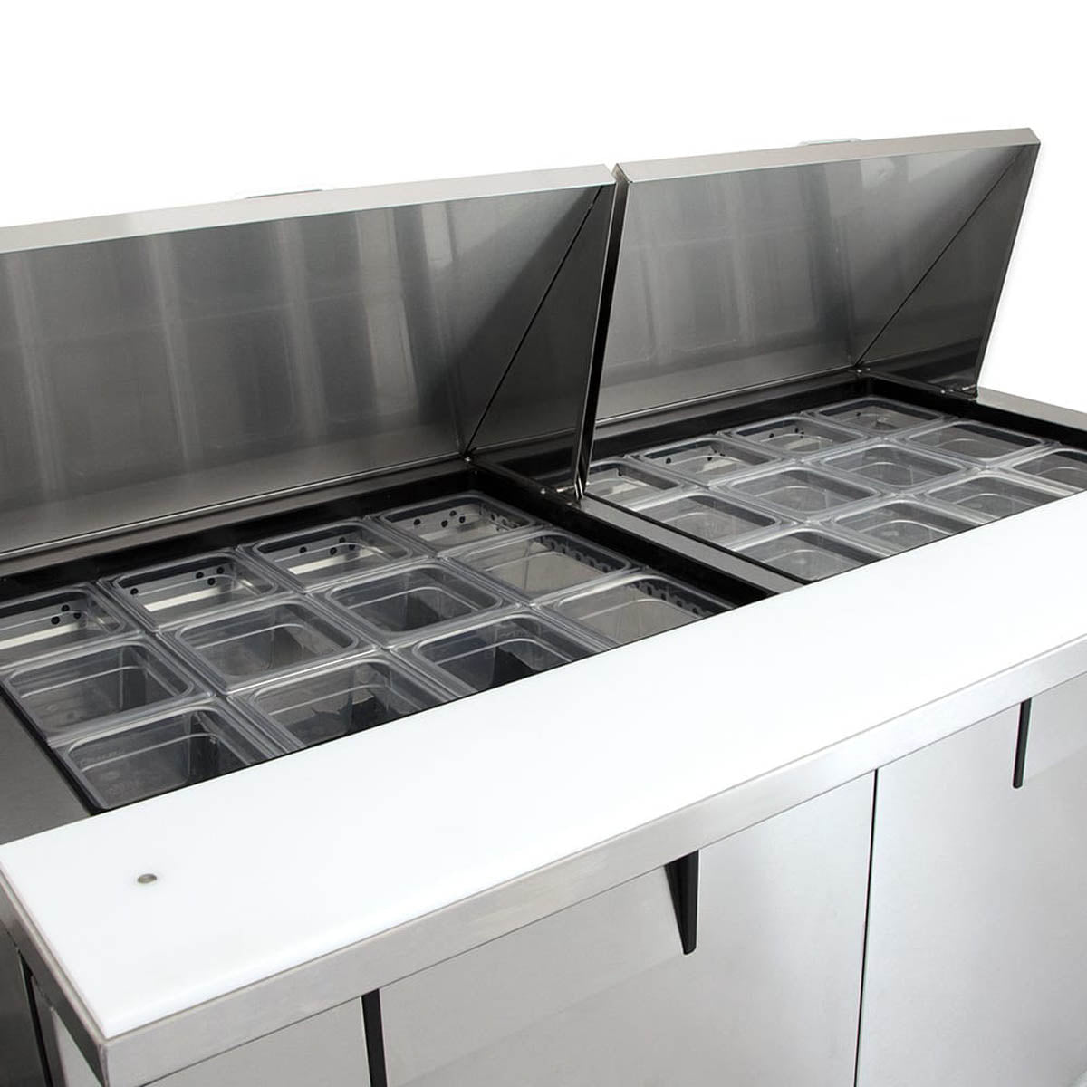 True TSSU-60-24M-B-ST-HC sandwich/salad prep table, close-up of the food pans and cutting board