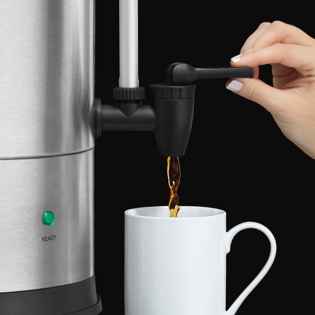 Waring WCU110X coffee urn faucet pouring coffee into a mug, side close-up