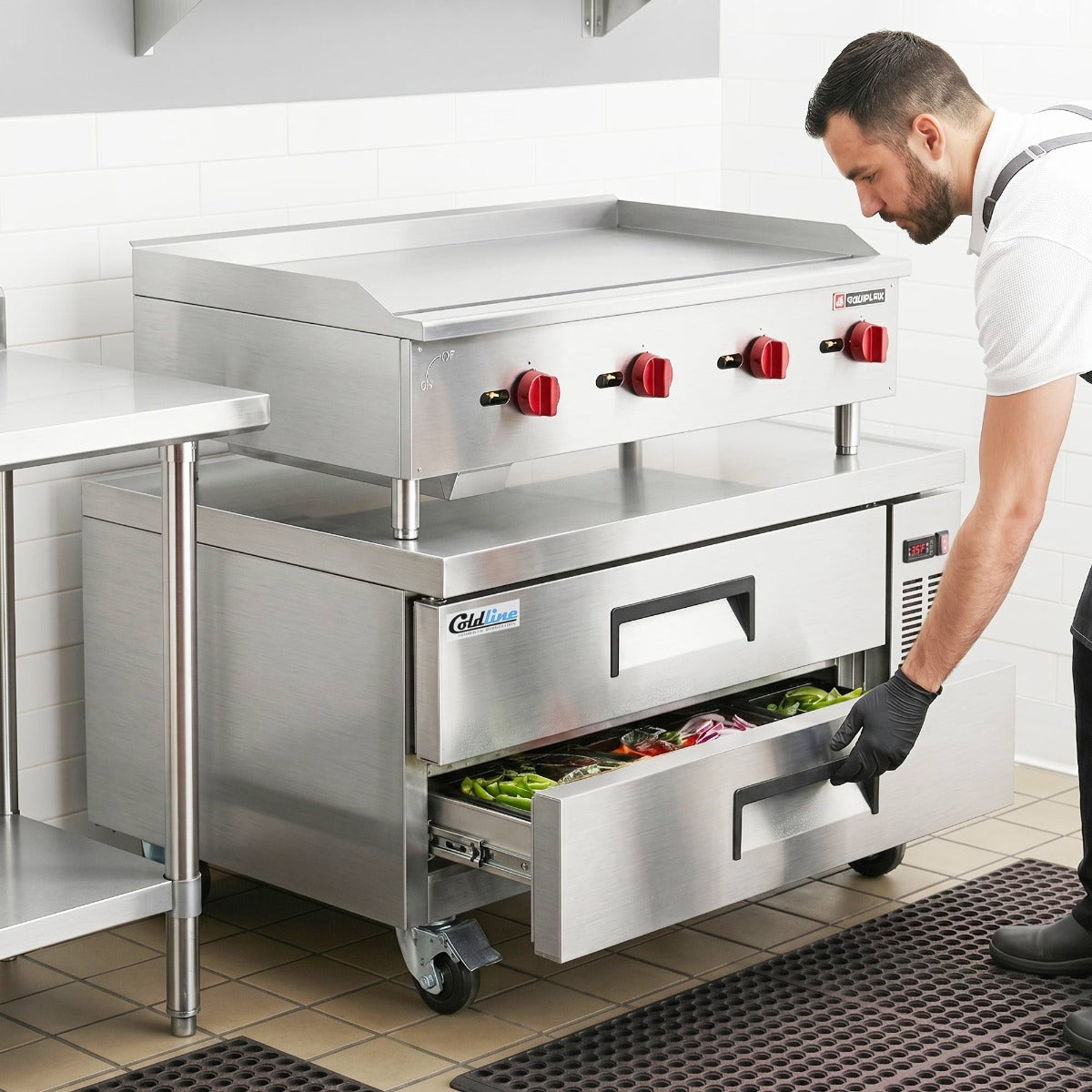 Coldline CB52 2-drawer refrigerated chef base, in use under a countertop griddle, lower drawer open (representative image)