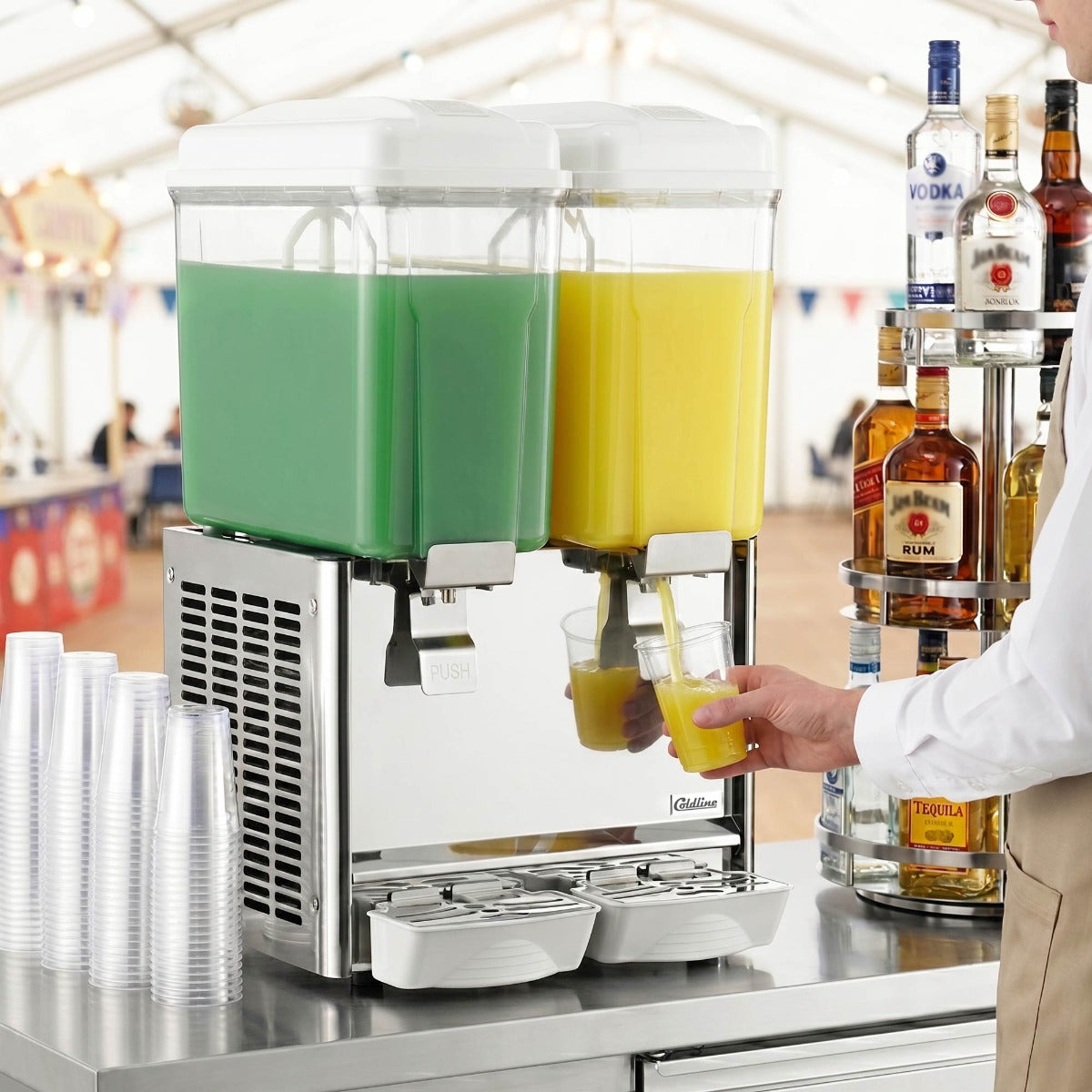 Coldline CBD-2 double bowl refrigerated beverage dispenser, in use, filling a glass at a counter (representative image)