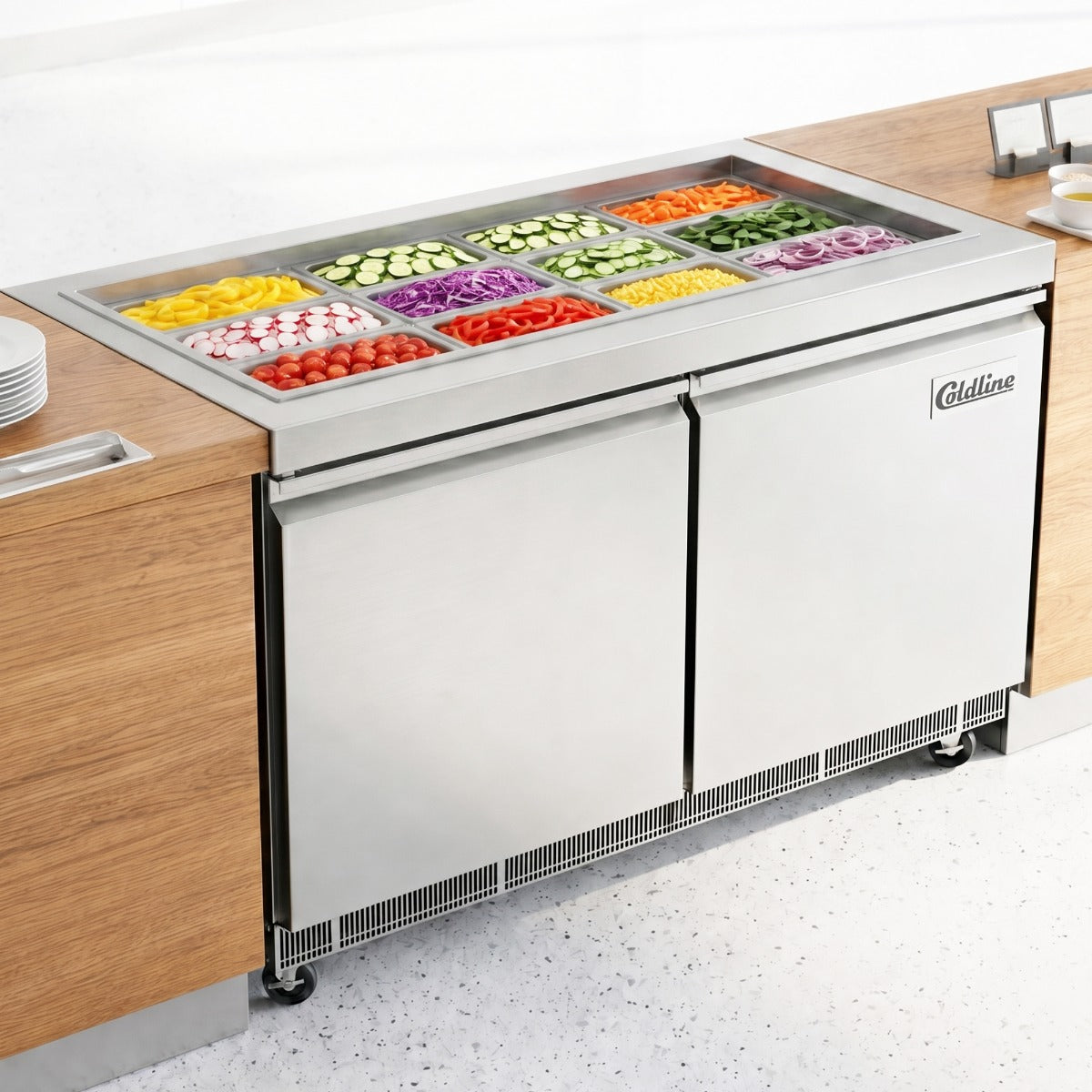 Coldline CBT-60 refrigerated salad bar buffet table, in use with food pans (representative image)