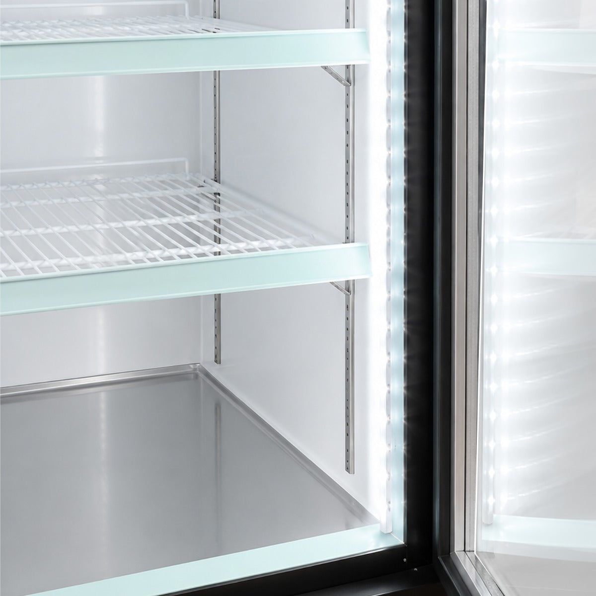 Coldline D30-B black glass door merchandiser freezer, LED-lit shelves inside the door, close-up