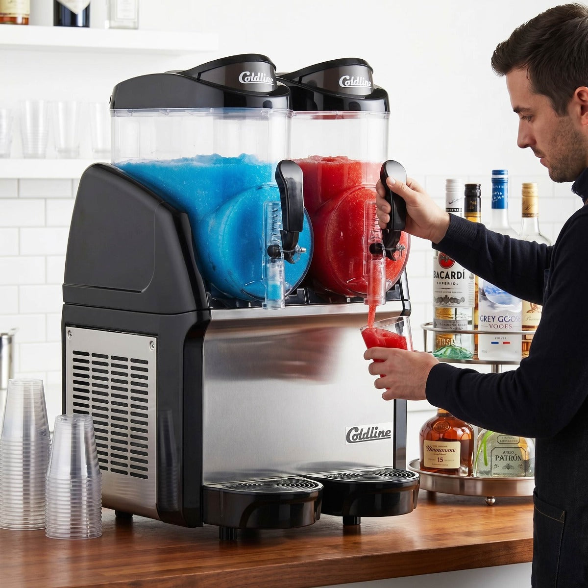 Coldline GRANITA-2N granita slush machine, serving slush at a bar