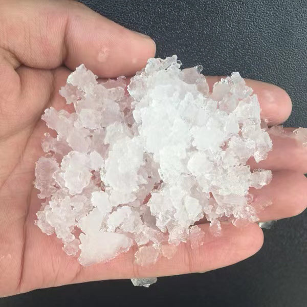 Coldline NU280 nugget ice machine, nugget ice in a hand, close-up