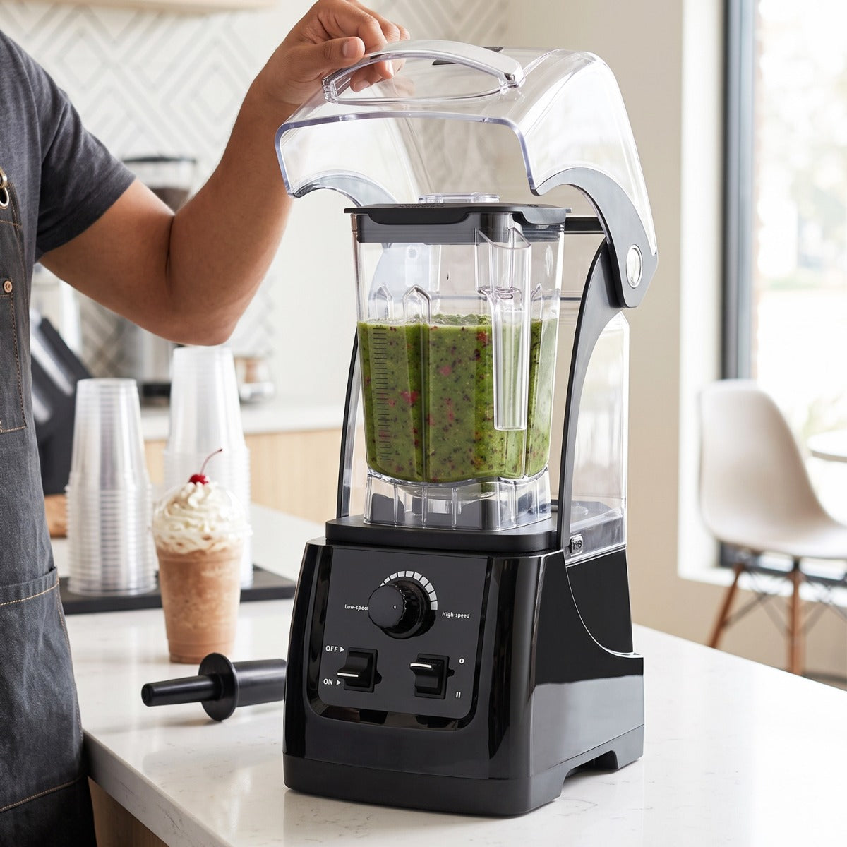 Prepline MIX6-Q64 blender in use, sound cover raised over a green smoothie