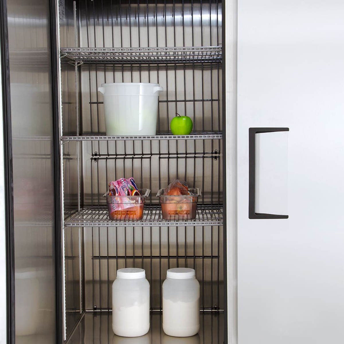 True TS-49F-HC 2-door solid reach-in freezer, interior close-up with stocked shelves