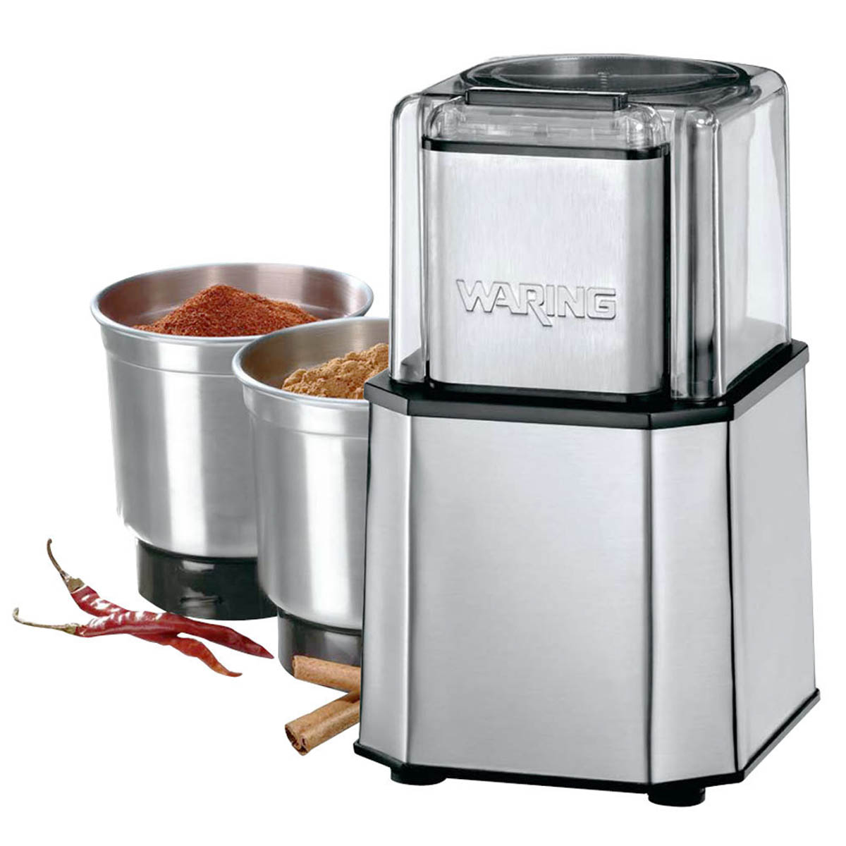 Waring WSG30 spice grinder with two bowls of ground spice, dried chilies and cinnamon sticks
